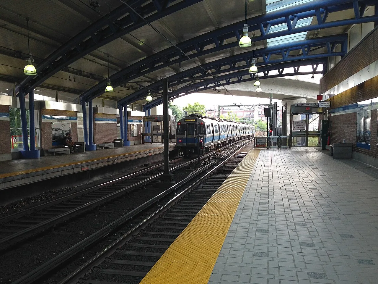 A northbound Blue Line train approaches the platform at the MBTA's Airport Station.