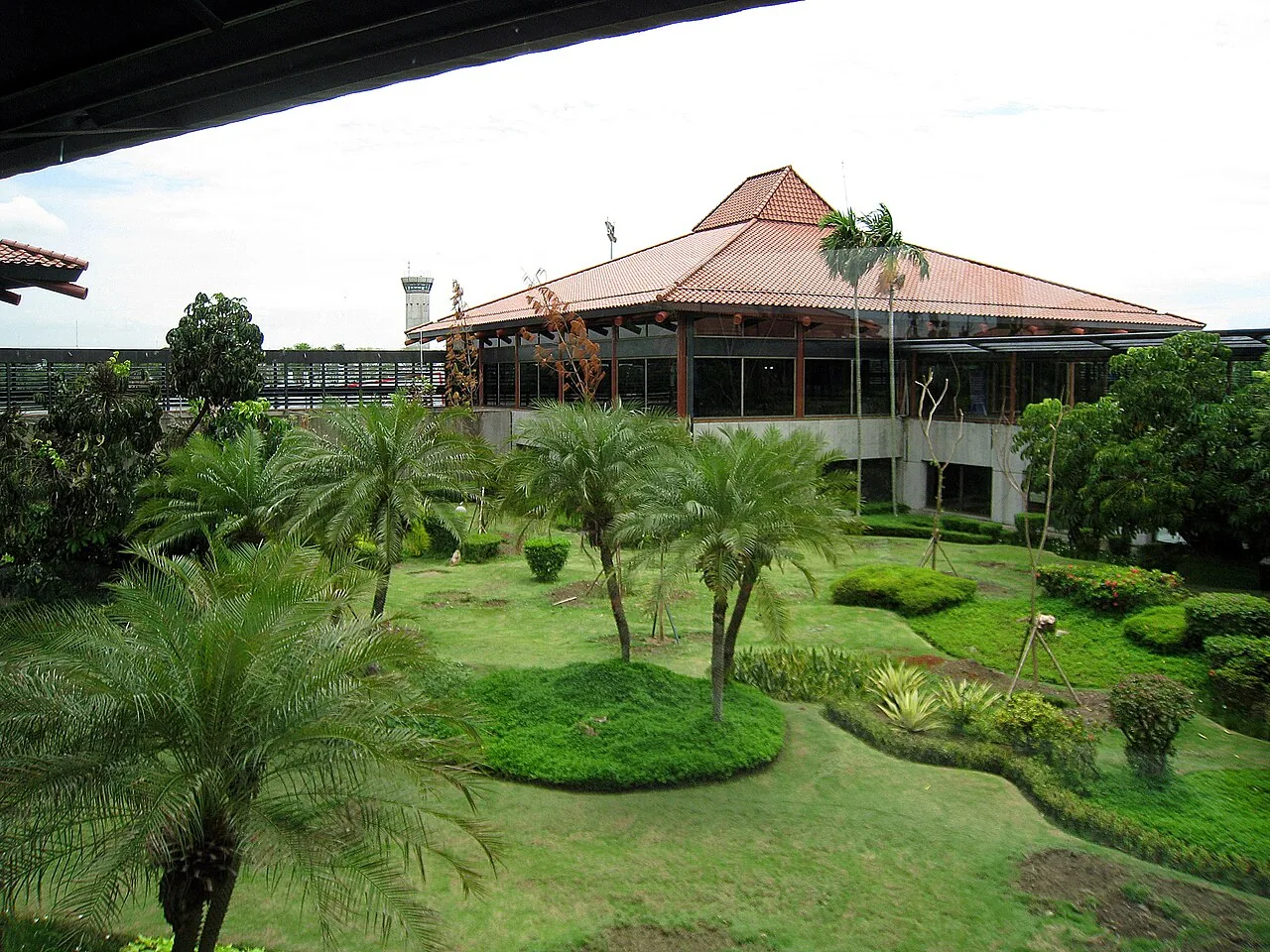 The Javanese Joglo architecture departure terminal with garden enclosure within. Soekarno Hatta International Airport Terminal 2, Jakarta, Indonesia.