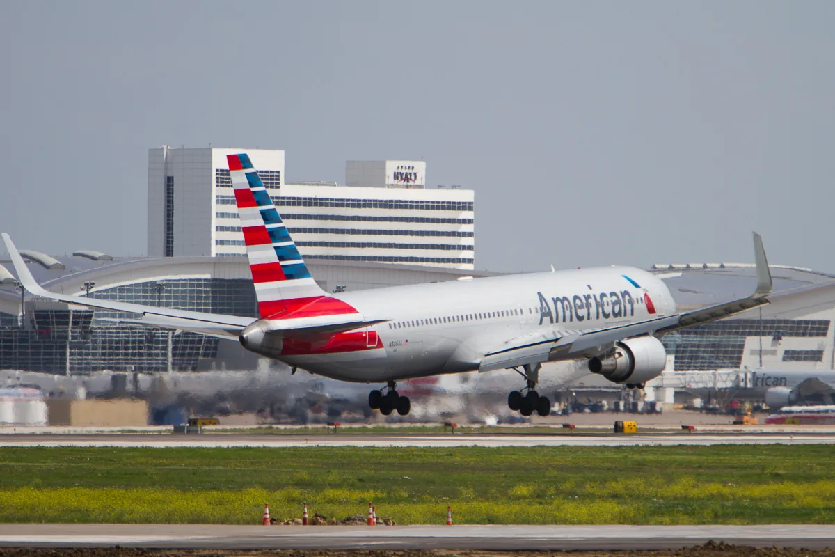American Airlines Boeing 767-300 seconds from touchdown at DFW Airport runway 18R. Airplane photo taken from Founder’s Plaza at DFW Airport. For additional photos see: DFW Airport Airplane Photos - April 2014 . Photo (cc