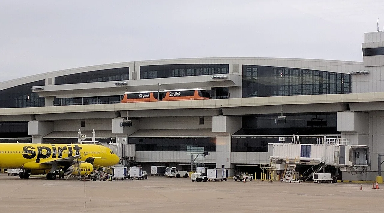 Skylink stopped at Terminal E station between gates E31 and E32.