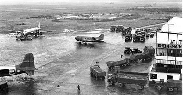 At Rhein-Main Air Base, Military and civilian supplies from Glessen Quartermaster Depot arrive in trucks of the 67th Transportation Company for transfer to waiting aircraft. Source - US Army photograph http://www.transch