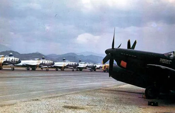 The flightline at Itazuke Air Base, Japan, 1950. The F-82 in the foreground belongs to the 69th All Weather Fighter Squadron, and the F-80s are assigned to the 8th Fighter-Bomber Group. (U.S. Air Force photo)