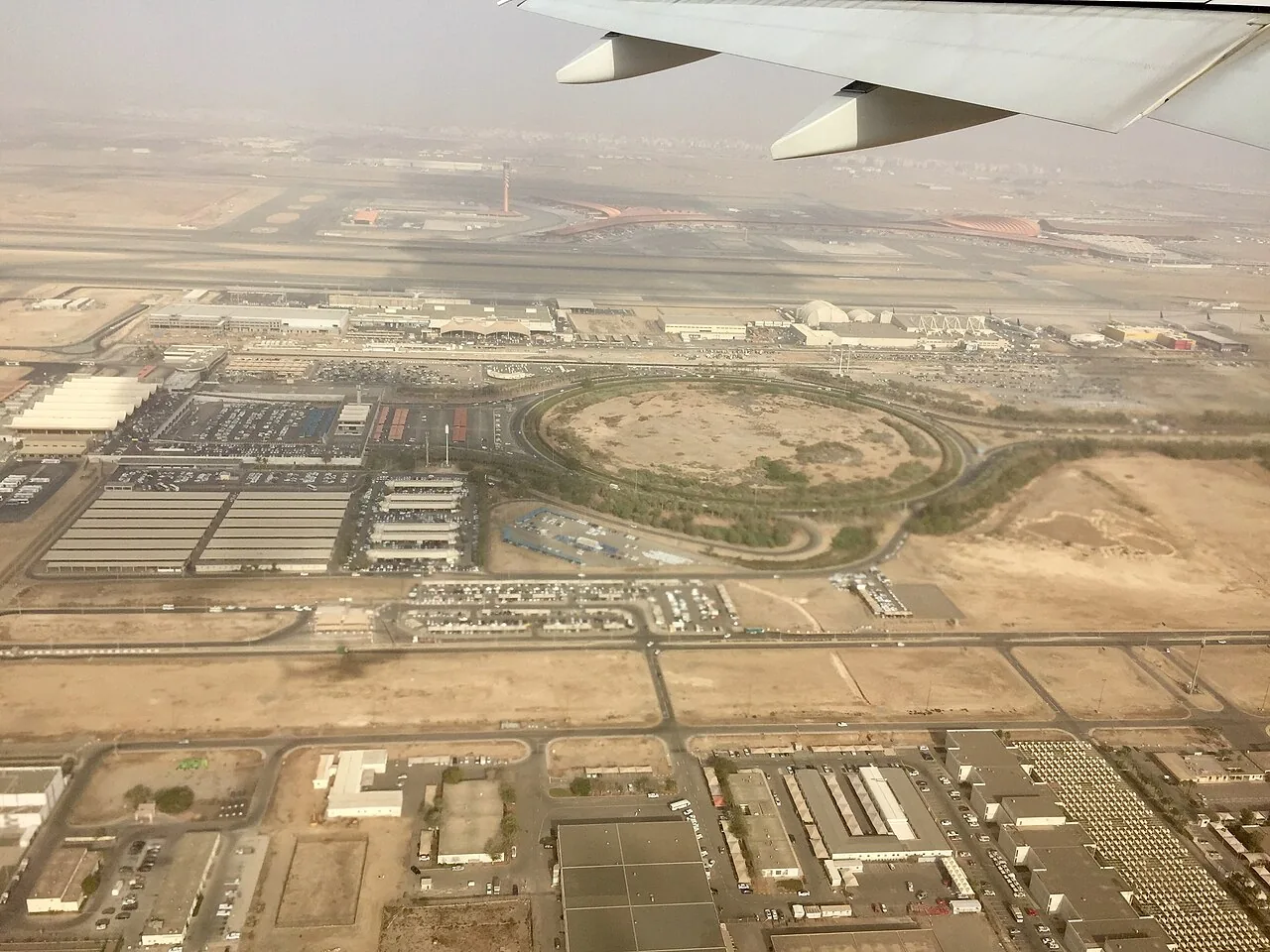 Aerial photograph of King Abdul Aziz International Airport - South Terminal, with the newer Terminal 1 in the background.