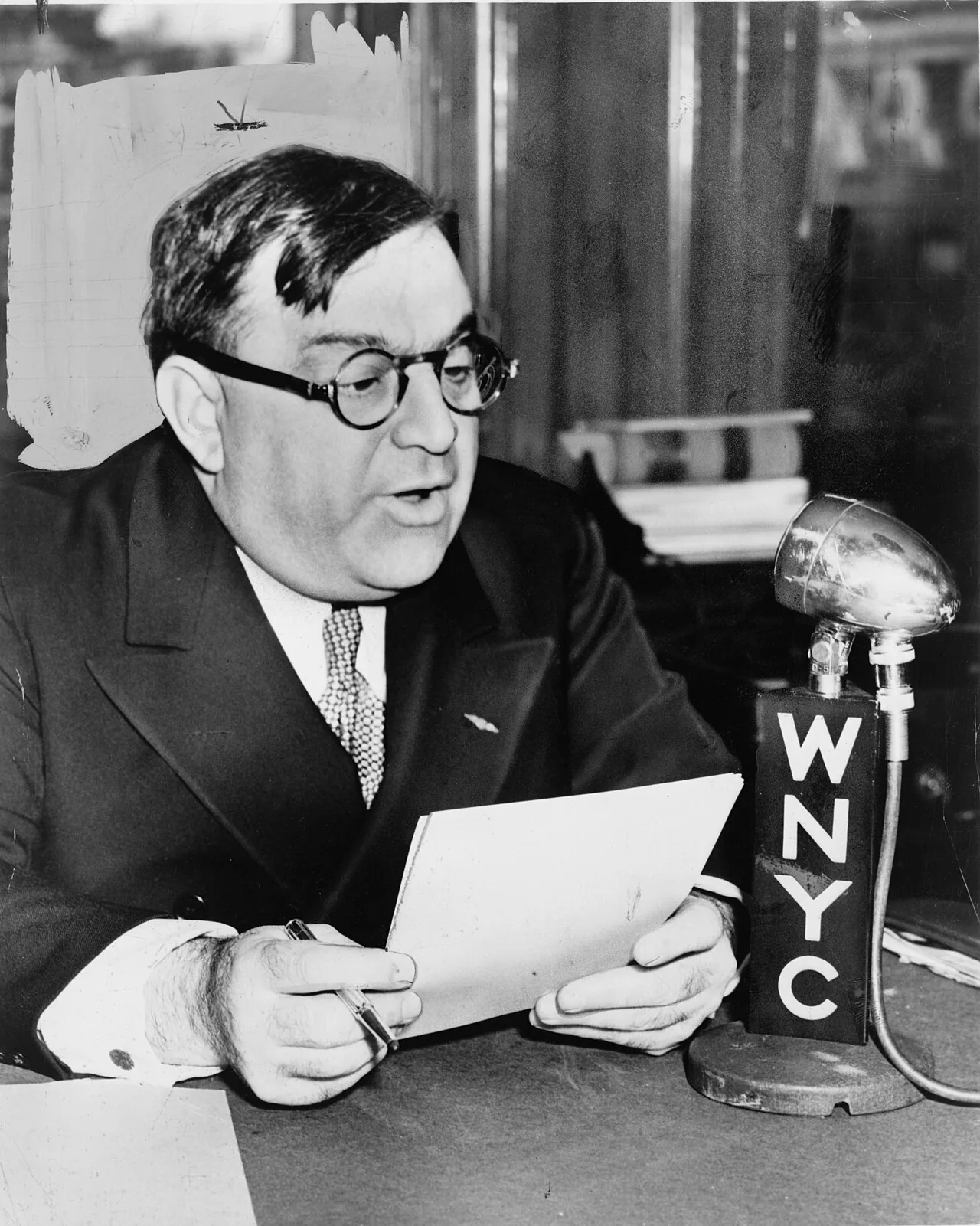 Fiorello H. LaGuardia , mayor of New York City. "Mayor La Guardia speaks over WNYC on Grade A milk from Budget Room."