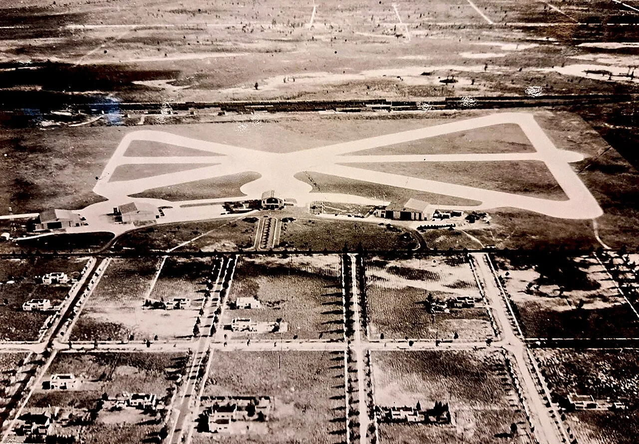 Aerial view looking south of Pan American Field and the original international airport built by Pan American Airways at NW 36th Street, Miami Florida, between June 1928 and April 1929. The terminal building with domed ro
