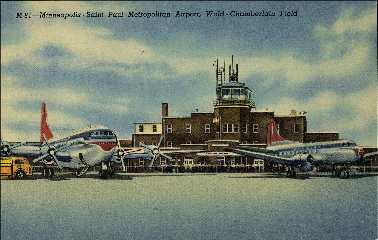 Printed on back: "This airport, one of the largest air terminals in the United States, is now an international port with service to Alaska and to the Far East. The U. S. Naval Reserve aviation base is located at this fie