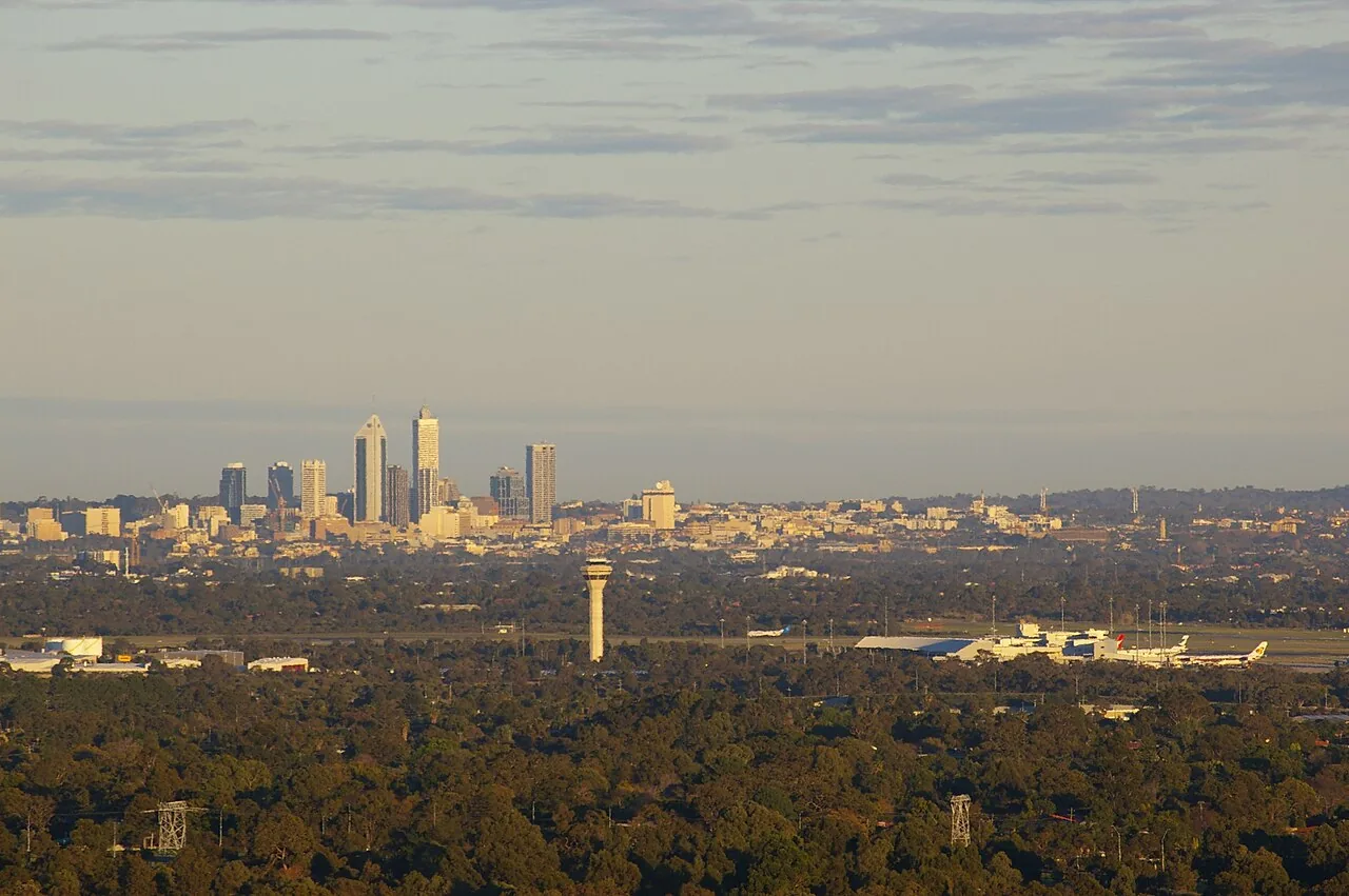 Perth Airport from the Zig Zag(looking west across the Swan Coastal Plain) showing its position in relation to the city centre, haze is due to the enviroment, image was taken 40 minutes after sunrise
