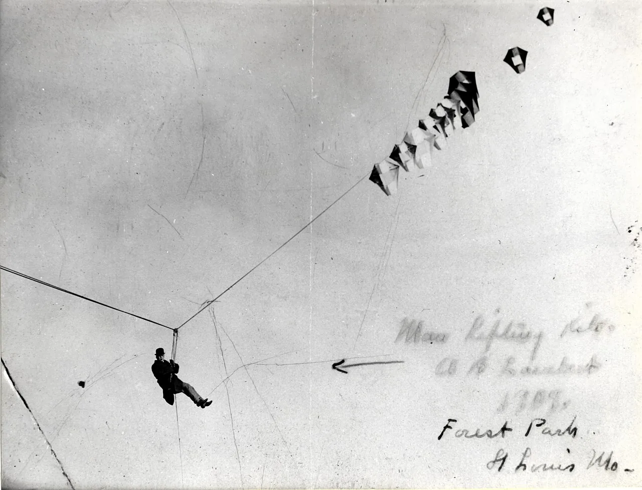 Title: Albert Bond Lambert lifted by a kite at the Forest Park airfield.