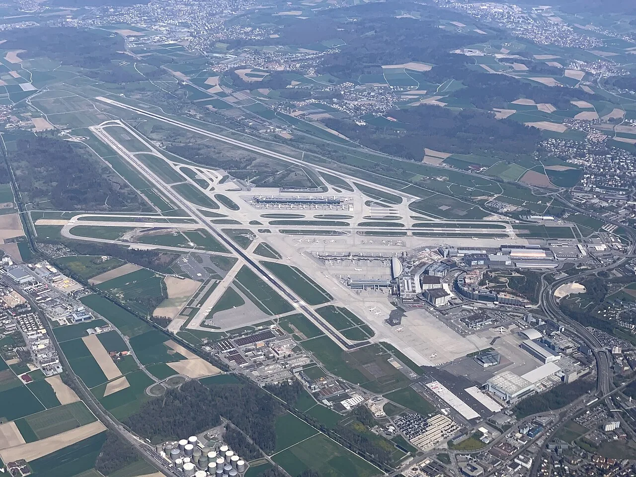 Aerial view of the Zurich Airport taken from an airplane over Unter-Affoltern; facing NE. Taken on the 19th of April 2019 at 12:46.